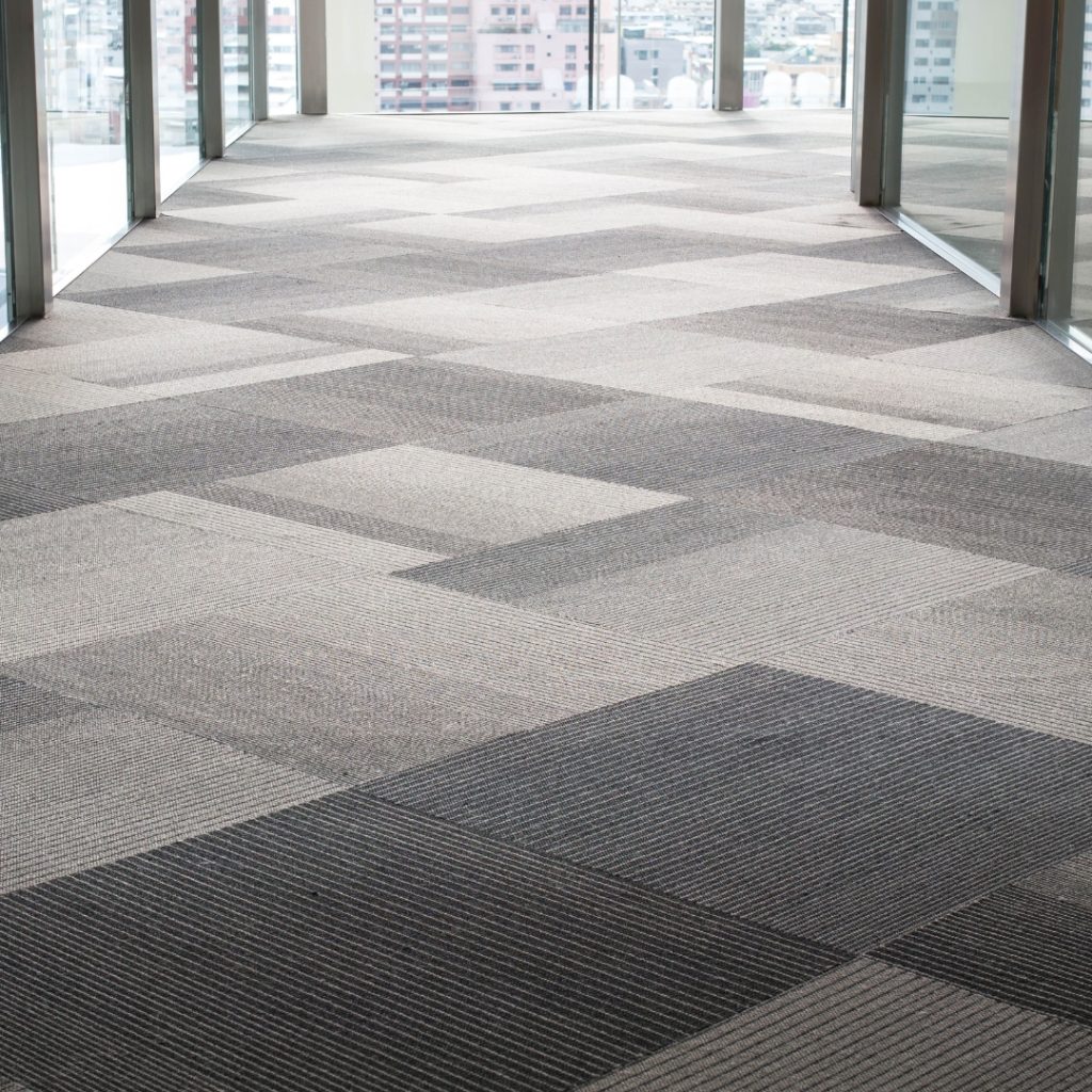 image presents Commercial Carpet Tiles in commercial office building which are gray and dark gray colour